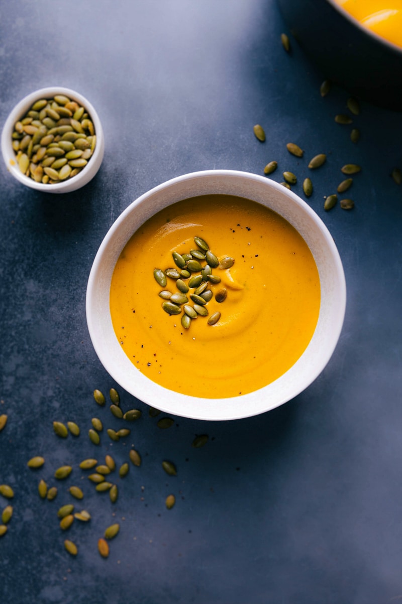 Overhead view of Sweet Potato Soup and pepitas for topping.