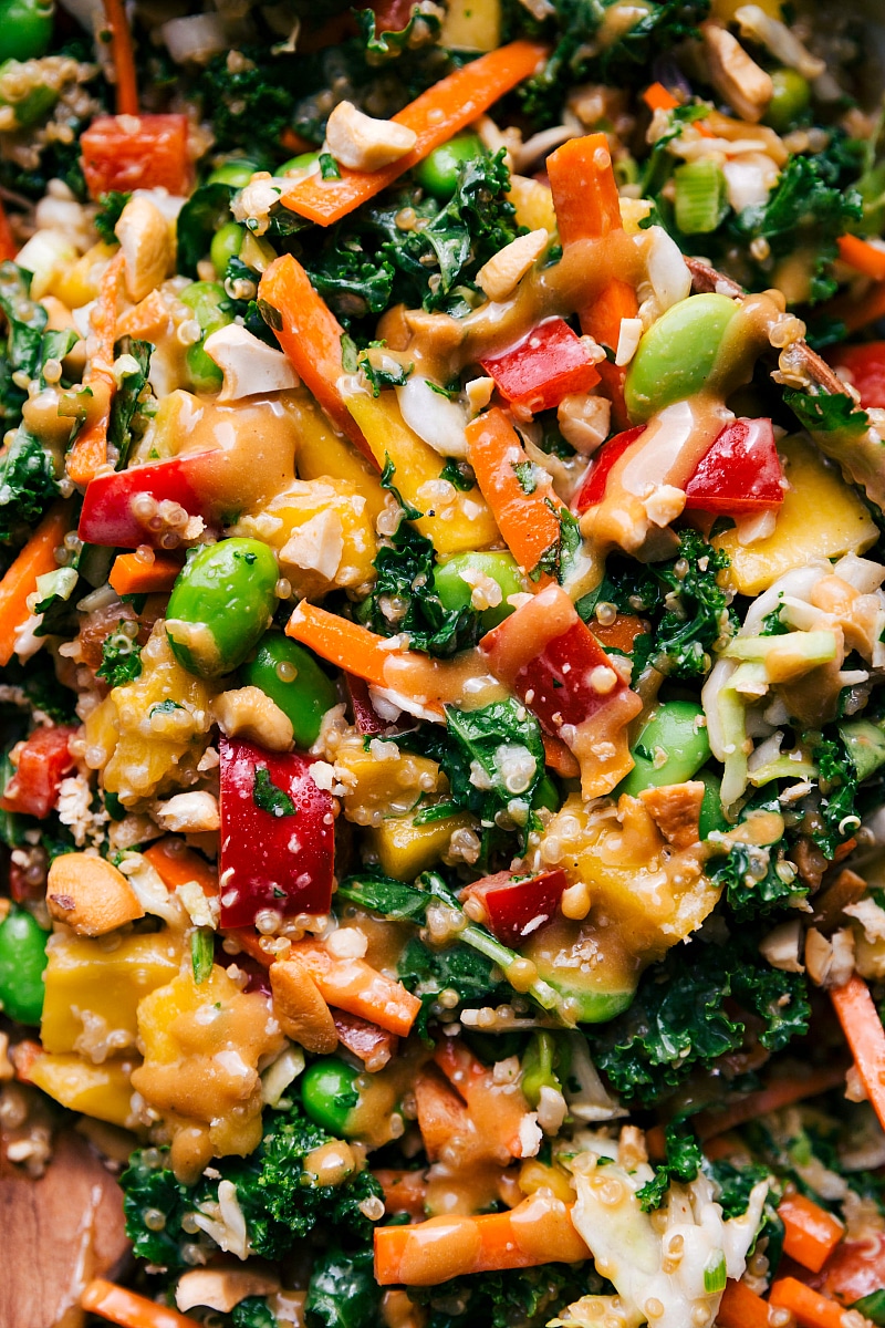 Fully tossed salad in a serving bowl, ready to be enjoyed by guests.