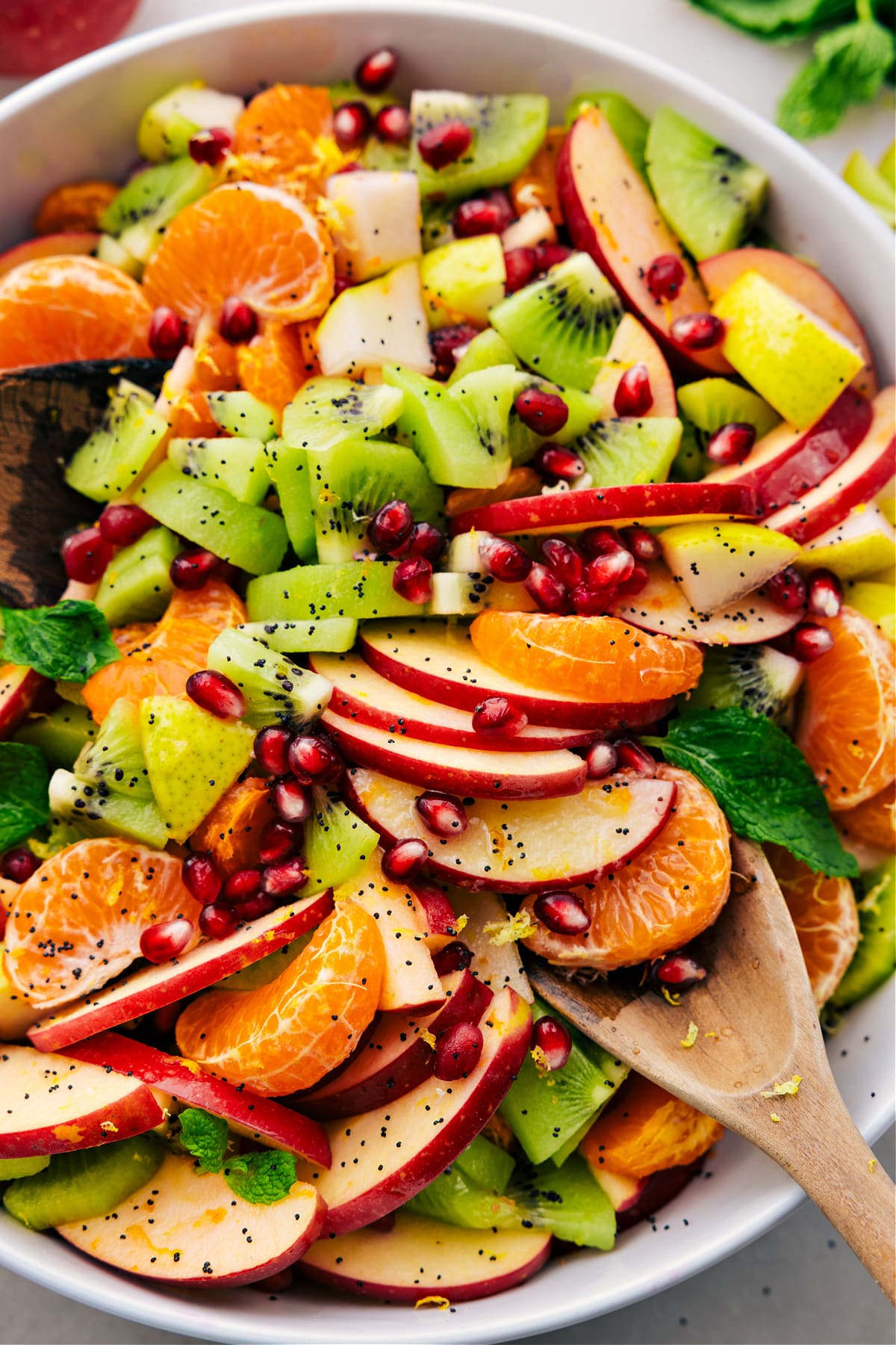 Delicious Winter Fruit Salad With In-Season Fruit Winter fruit salad in a bowl, dressed and ready to enjoy.