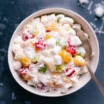 Bowl filled with a delicious serving of Ambrosia Salad.