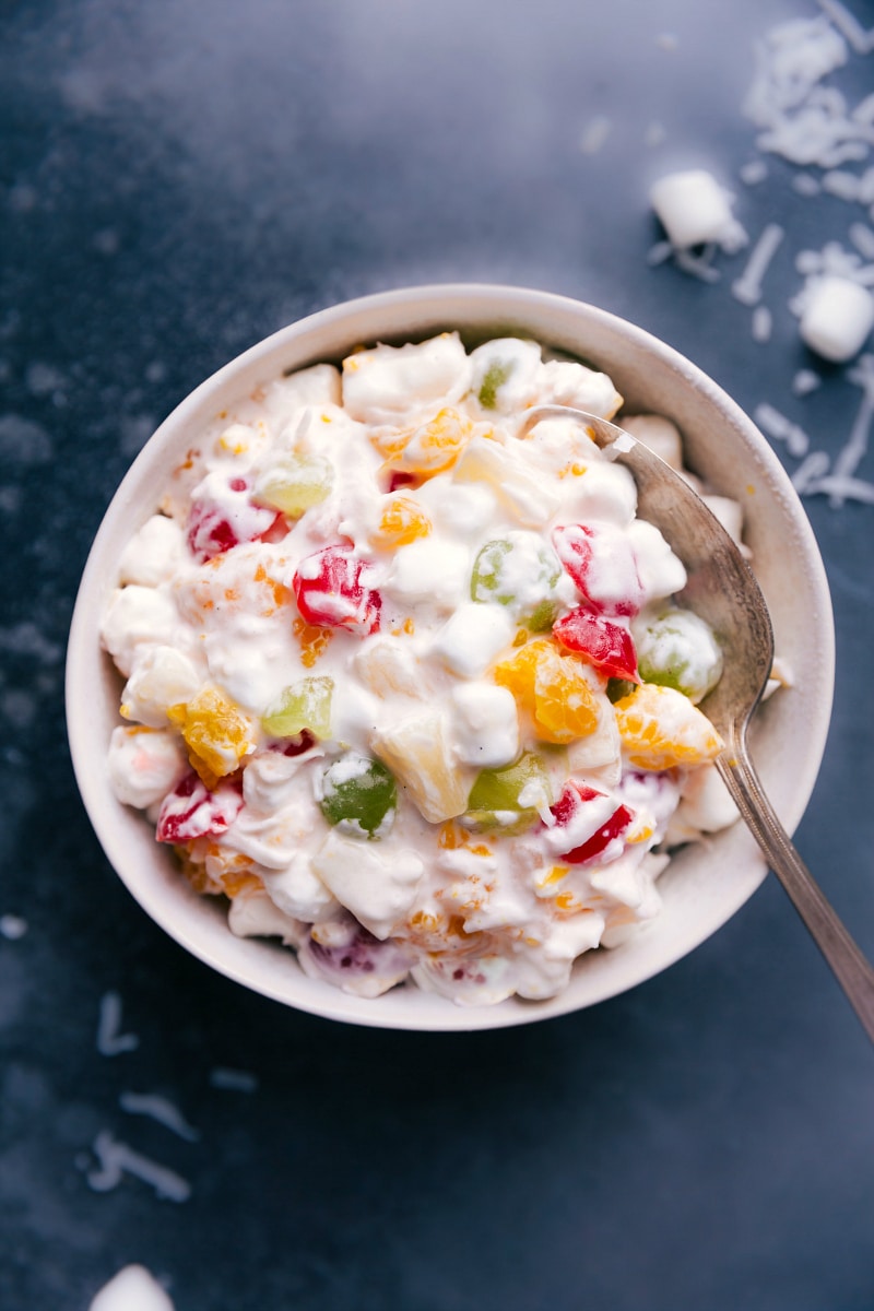 Bowl filled with a delicious serving of Ambrosia Salad.