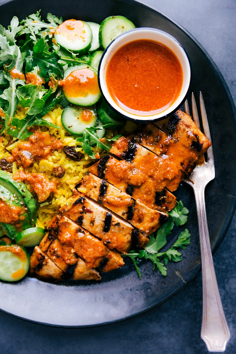 Chicken and Yellow Rice on a plate ready to be eaten.