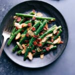 Seasoned Green Beans on a plate, with a fork on the side.