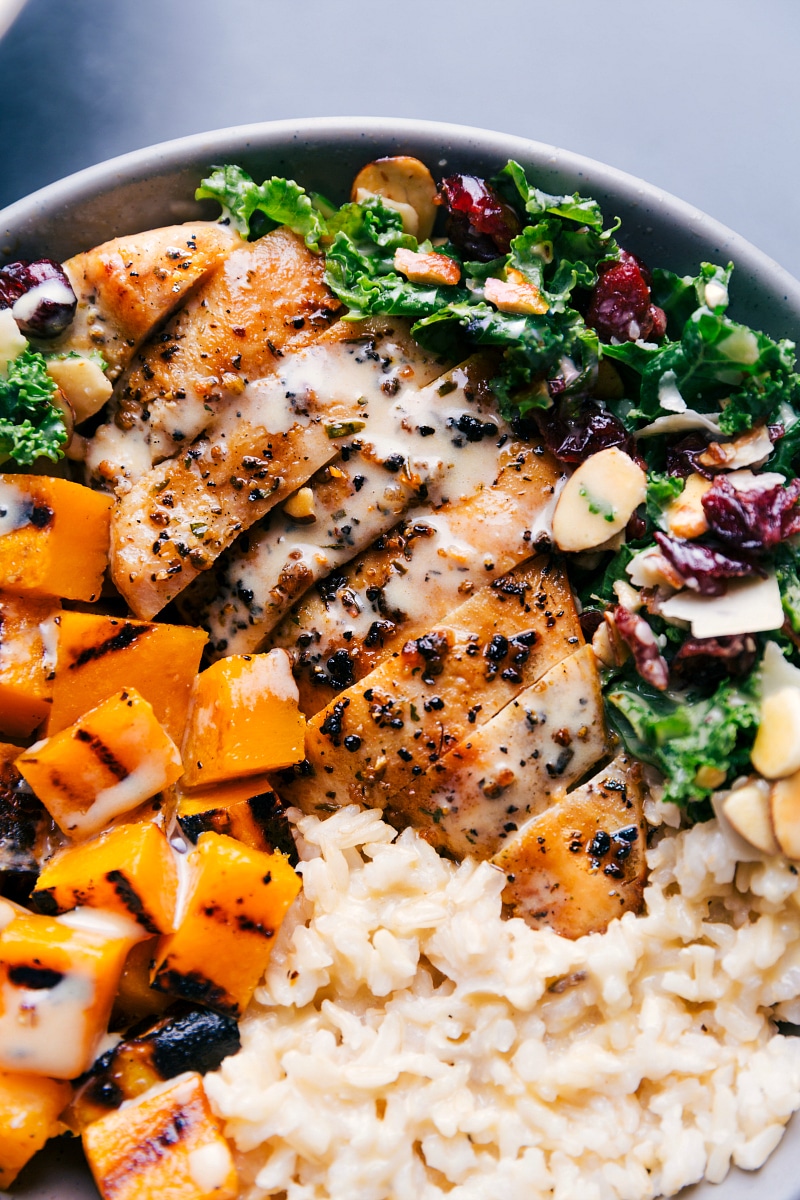 Up-close overhead image of the Harvest Bowl with dressing drizzled over it.