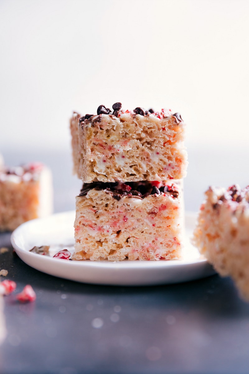 View of two Peppermint Rice Krispies Treats stacked on a plate.