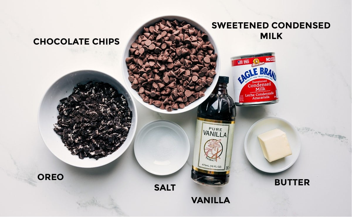 Ingredients In Chocolate Covered Oreo Fudge All the ingredients in this recipe prepped out including the crushed Oreos, chocolate chips, sweetened condensed milk, salt, vanilla, and butter.