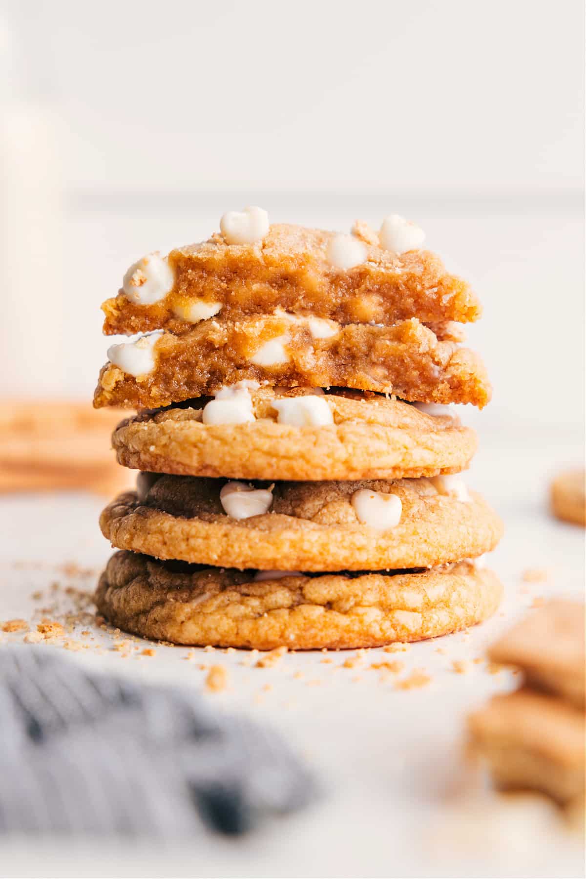 Graham Cracker Cookies Are Irresistable Graham cracker cookies stacked on top of each other with cookies split in half on top to show the insides.