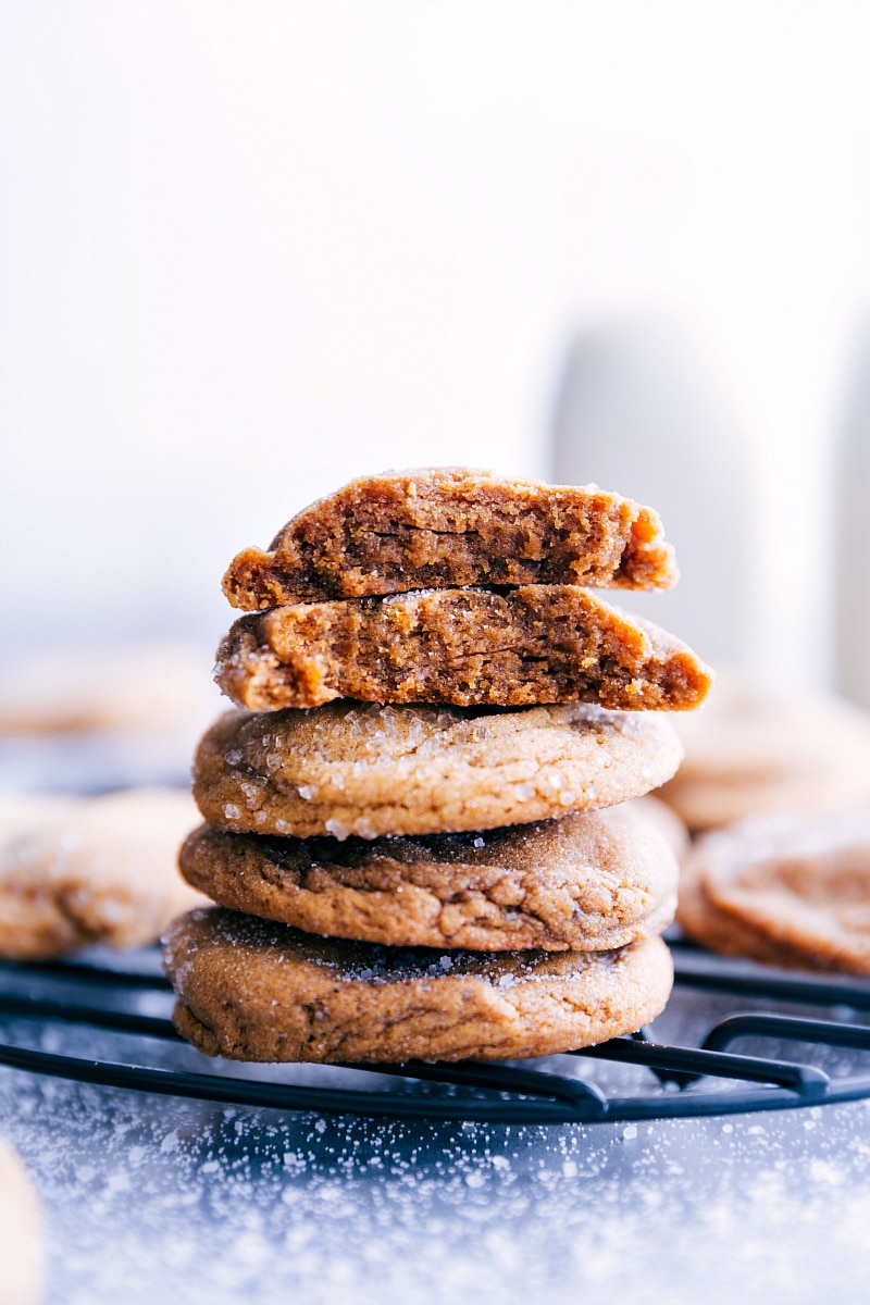 These tender, sweet Gingersnap Cookies have thick, chewy centers with crackling, crisp edges and the perfect blend of holiday spices. Recipe via Chelseasmessyapron.com #gingersnaps #cookies #Christmas #winter #easy #homemade #ginger #spices A plate of Gingersnap Cookies stacked up.