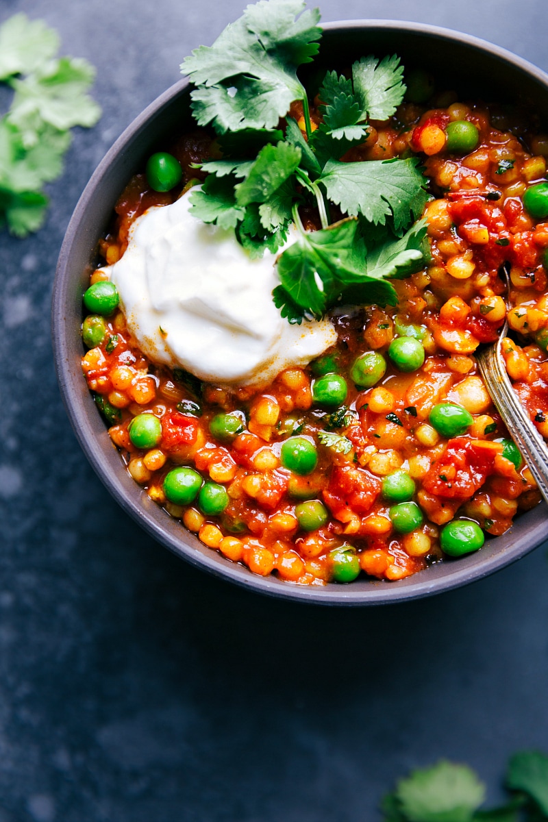 View of Moroccan Stew with a scoop of Greek yogurt and cilantro on top.