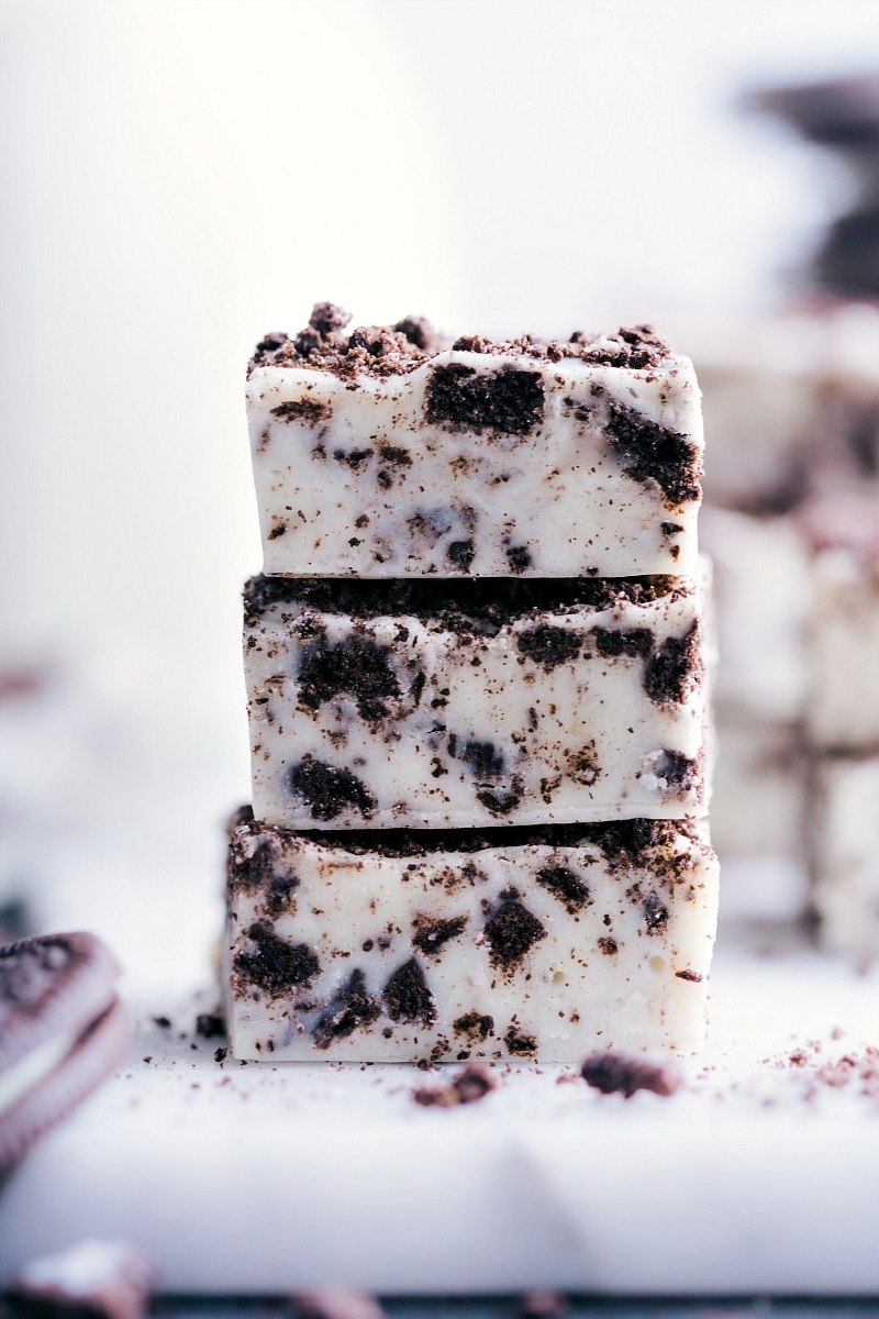 Close-up image of a stack of three pieces of Oreo Fudge.