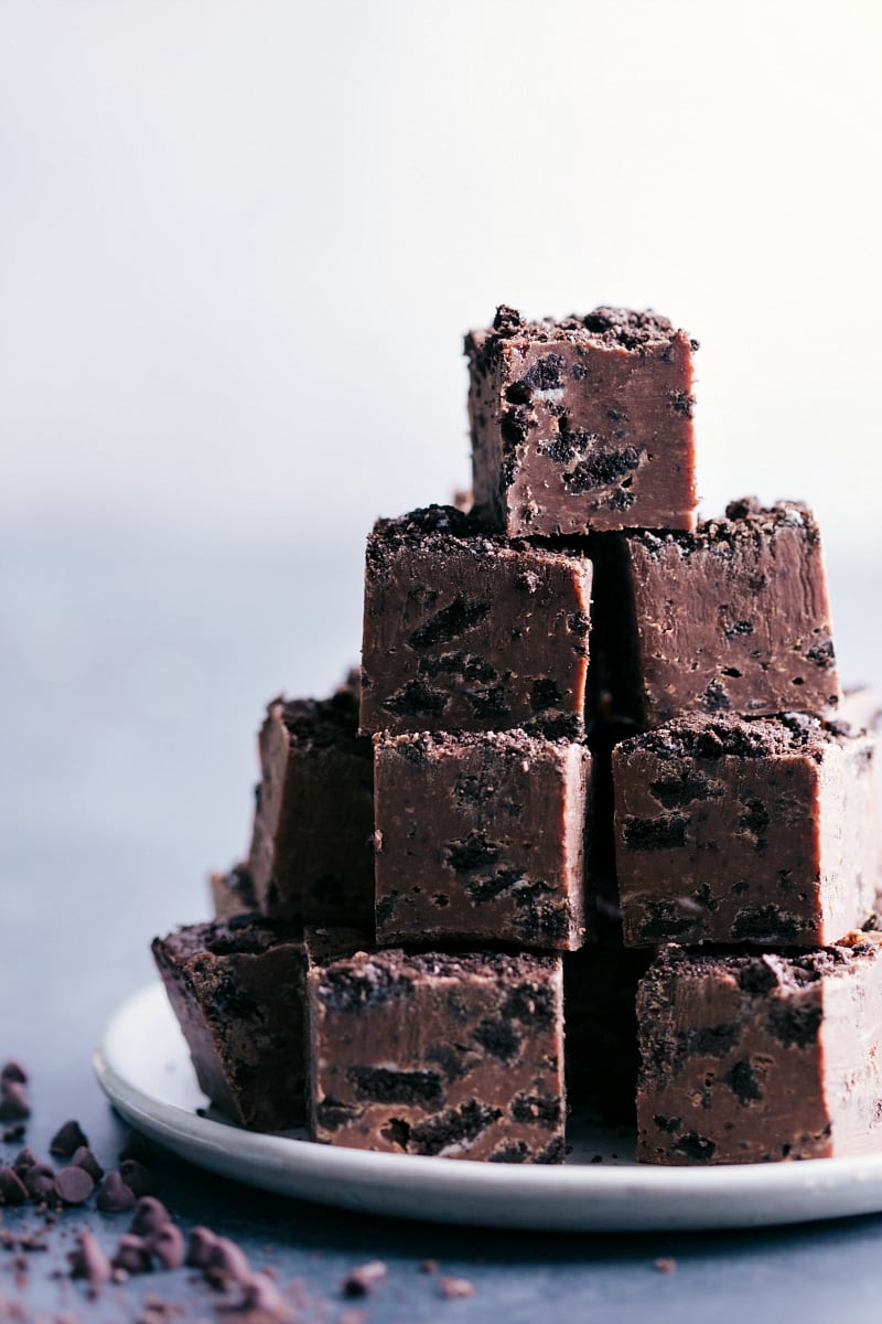 A stack of Chocolate-Covered Oreos Fudge pieces on a plate.