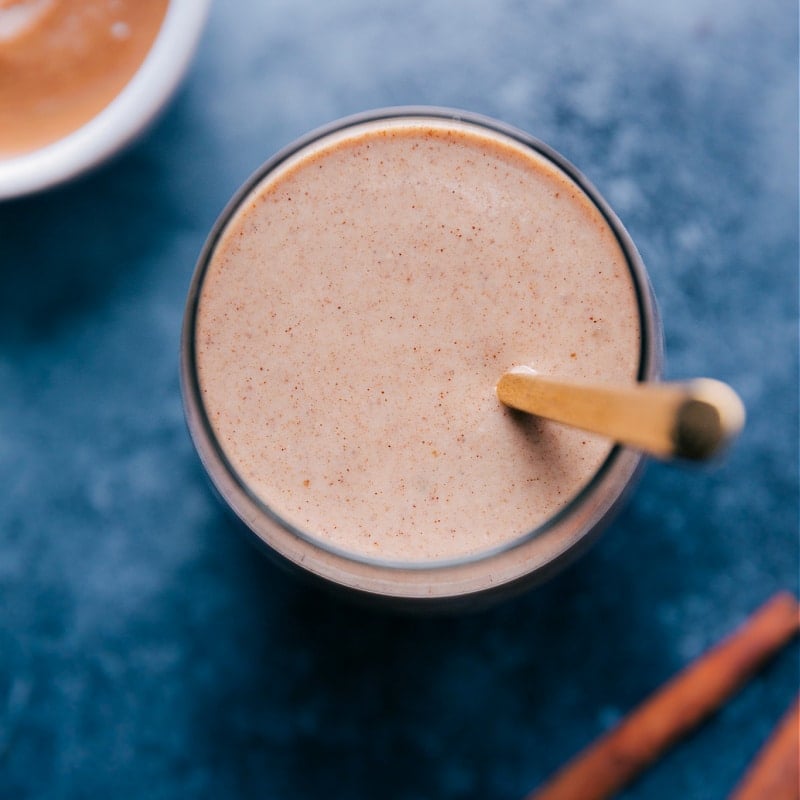 Image of the smoothie in a cup with a spoon in it, ready to be served.