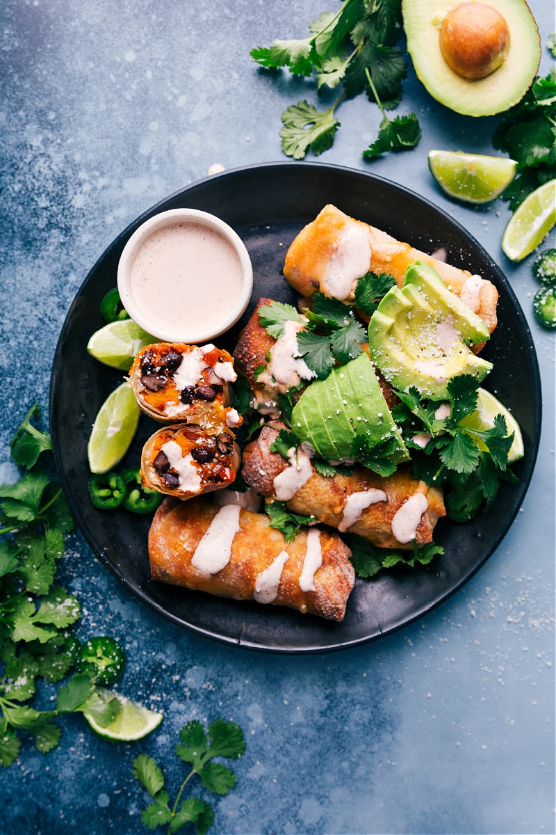 Black Bean Egg Rolls with chili-lime sauce, on a plate