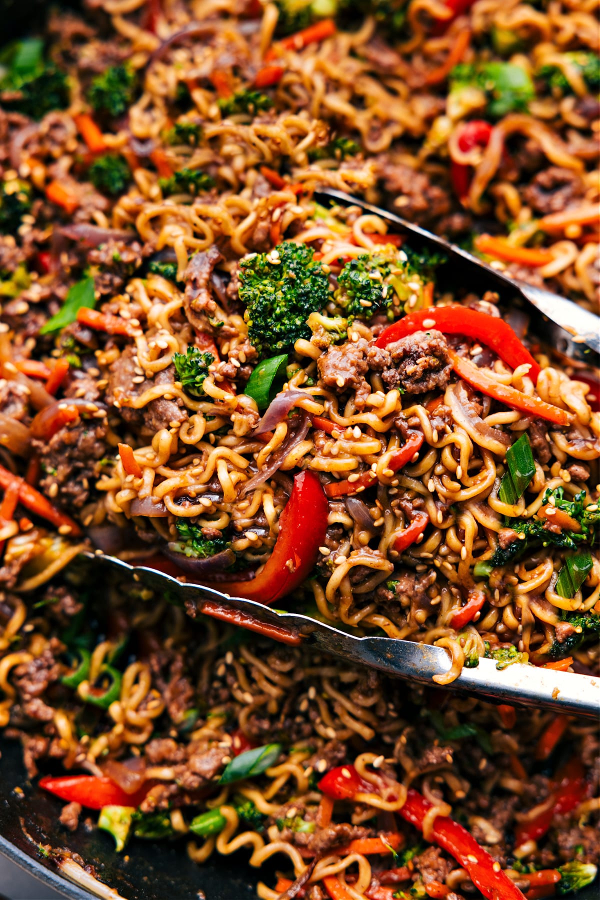 Ground Beef Ramen in the skillet, ready to be served and enjoyed, topped with sesame seeds.