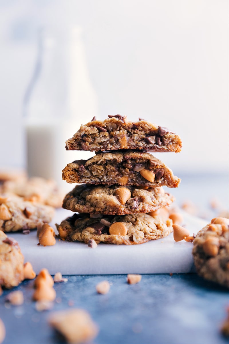 These sweet Oatmeal Scotchies have a thick and chewy center with crisp edges. You'll love the deep caramel notes with a hint of cinnamon spice and all that butterscotch and crushed toffee! Recipe via ChelseasMessyApron #dessert #best #quick #easy #simple #treat snack #chocolatechips #oats #oatmeal #scotchies A stack of Oatmeal Scotchies
