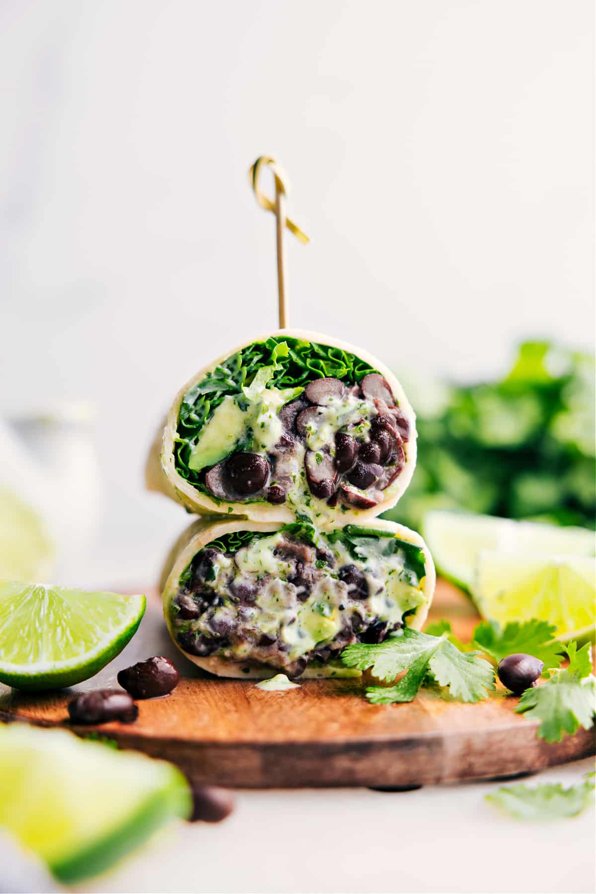 The Best Black Bean Wraps Recipe Black Bean Wraps, cut in half and stacked on top of each other.