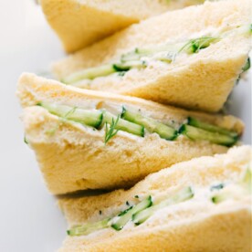Cucumber Sandwiches served on a platter.