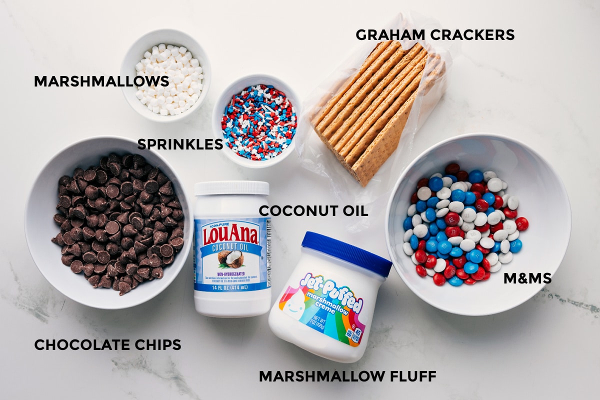 This 4th of July Bark Recipe is the perfect patriotic treat! Recipe via ChelseasMessyApron #festive #chocolate #whitechocolate #m&ms #sprinkles #dessert #treat #fourthofjuly #bark