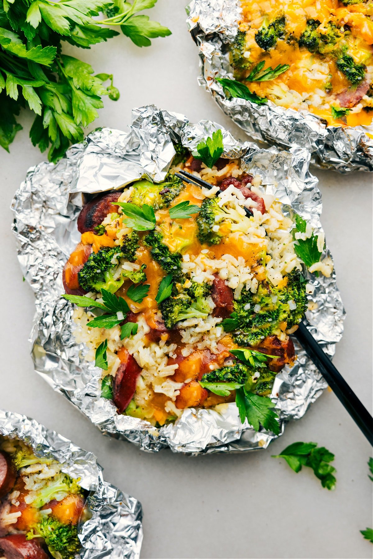 The Best Foil Pack Cheesy Broccoli & Chicken Foil Pack Cheesy Broccoli & Chicken fresh off the grill ready to be enjoyed.