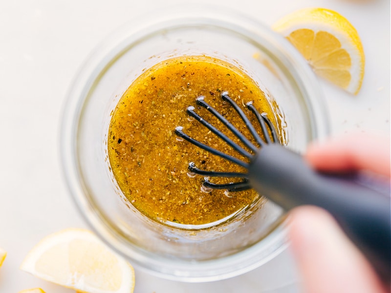 Image of the Greek Salad Dressing all mixed together and ready to be poured over a salad