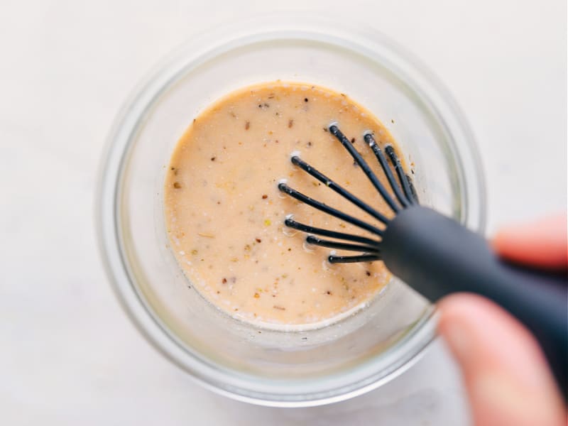 Overhead image of Italian Dressing being whisked together