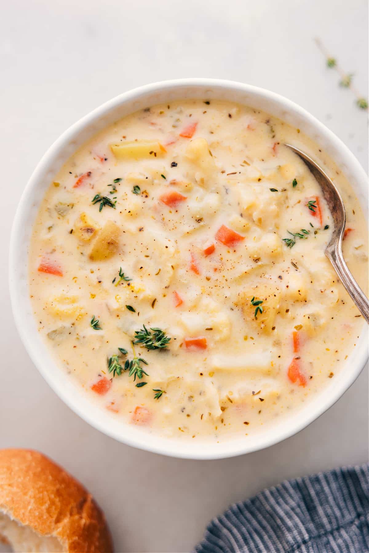 Hearty And Delicious Cauliflower Soup Cauliflower Soup fills a bowl, topped with fresh thyme.