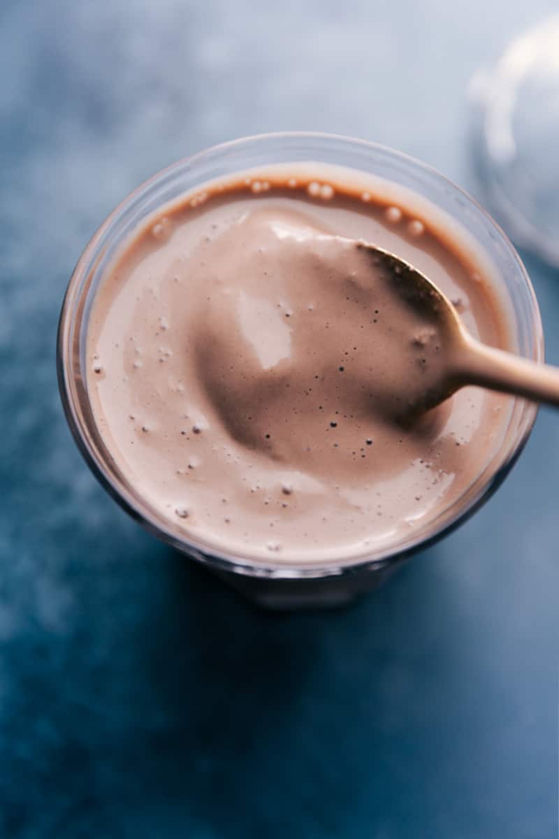 A rich, thick, and creamy Malted Milkshake makes for the most delicious dessert and it couldn't be much easier to make! Throw a few ingredients into a blender, let it whirl, and enjoy a malt good enough to rival even the best old-fashioned diner! Recipe via ChelseasMessyApron #dessert #best #quick #easy #simple #chocolate #frosty #malted #milkshake Overhead image of the Malted Milkshake