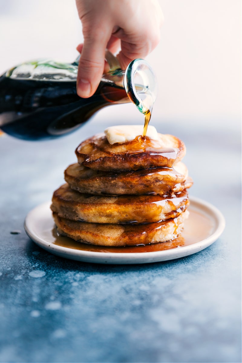 Overhead image of Pancake Syrup being poured over the pancakes