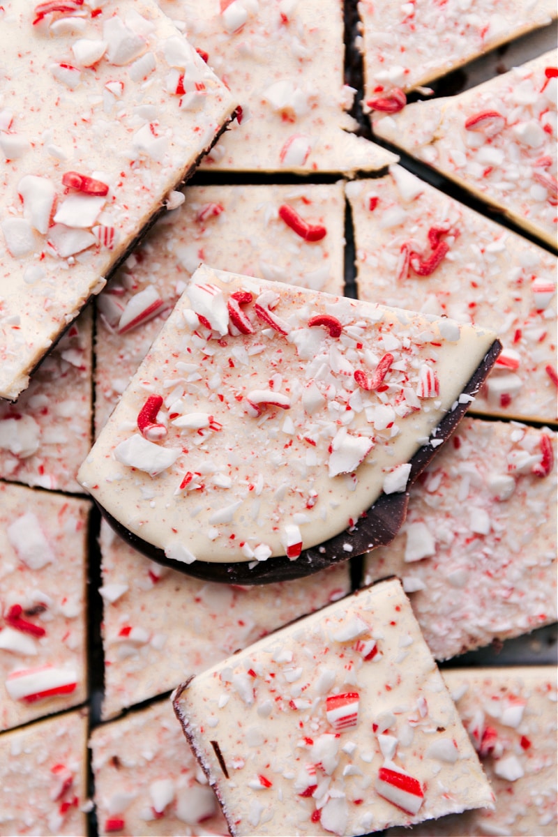 This is our favorite Peppermint Bark recipe complete with 3 types of chocolate and crushed peppermint -- do holiday treats get any better than this?! Recipe via ChelseasMessyApron #dessert #best #quick #easy #simple #christmas #holidays #peppermint #bark Overhead image of Peppermint Bark