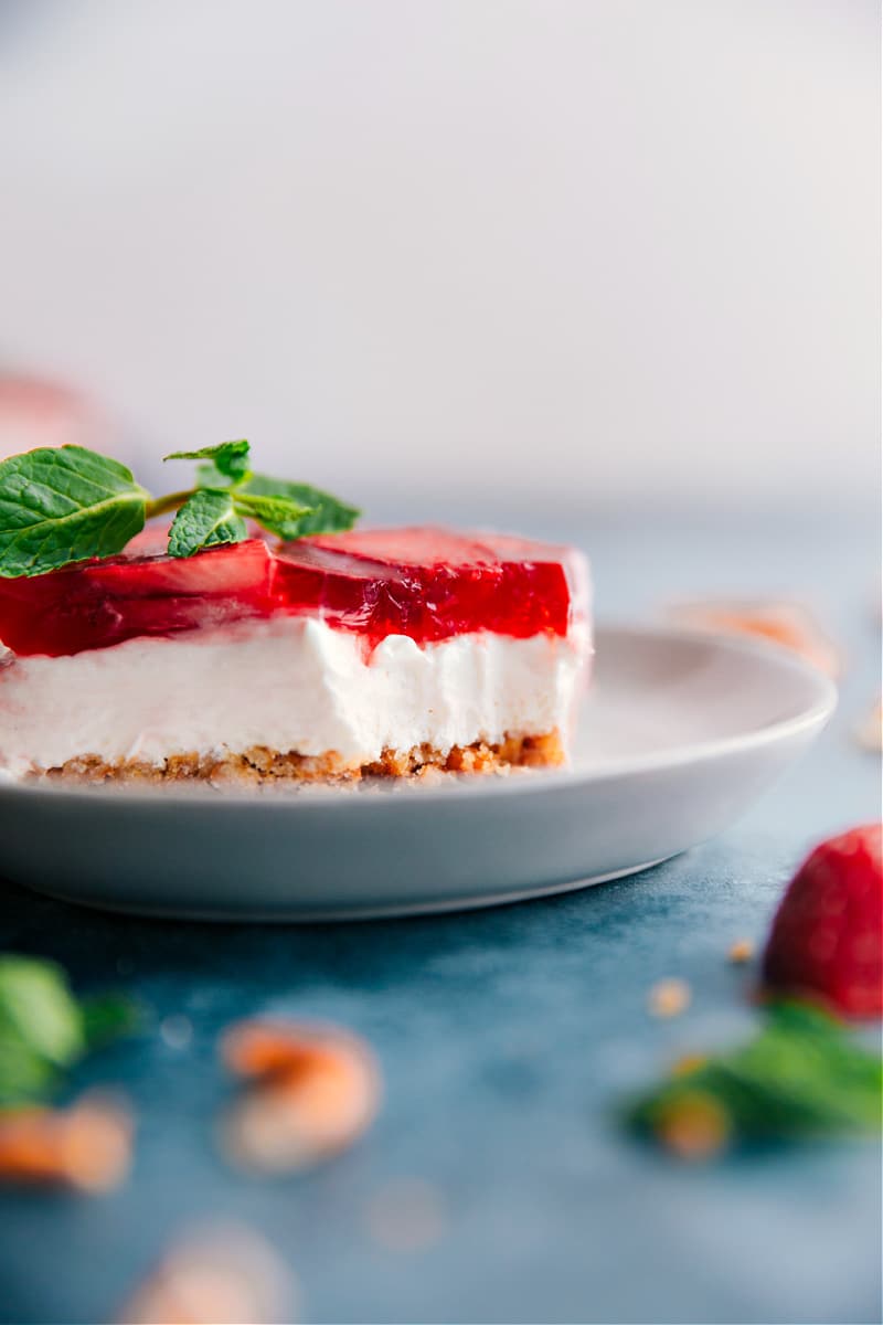 Strawberry Pretzel Salad on a plate with a bite taken out of it