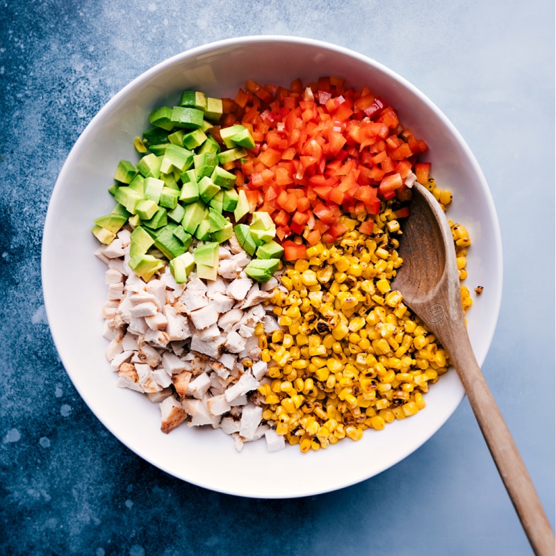 Process shots of the Mexican Street Corn Chicken Salad-- image of all the ingredients added into a bowl