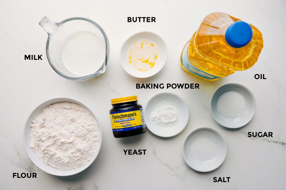 Ingredients In This Fry Bread Recipe All the ingredients in this recipe prepped out for easy assembly including the flour, milk, yeast, butter, baking powder, salt, sugar, and oil.