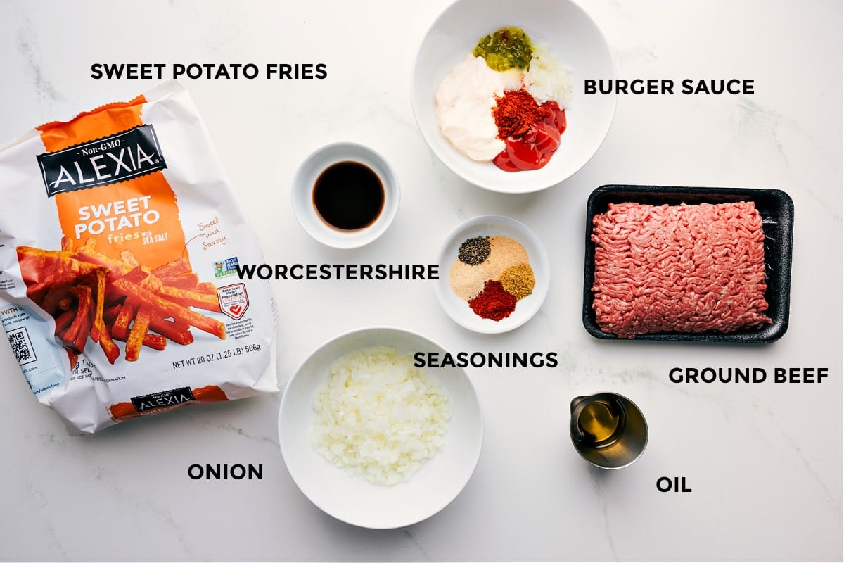All the ingredients prepped for easy assembly—sweet potato fries, burger sauce, Worcestershire, spices, ground beef, oil, and onion.