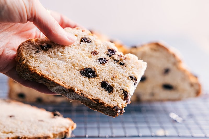 Image of a slice of Irish soda bread ready to be eaten