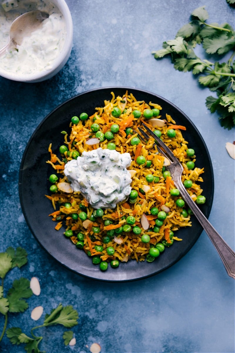 Overhead image of the dish on a plate with a cooling cucumber sauce