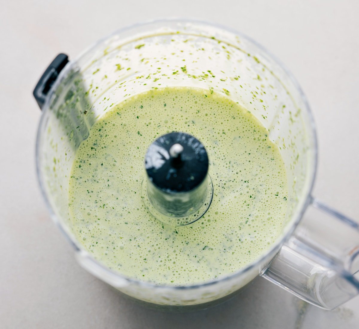 All the ingredients being pulsed together in a food processor.