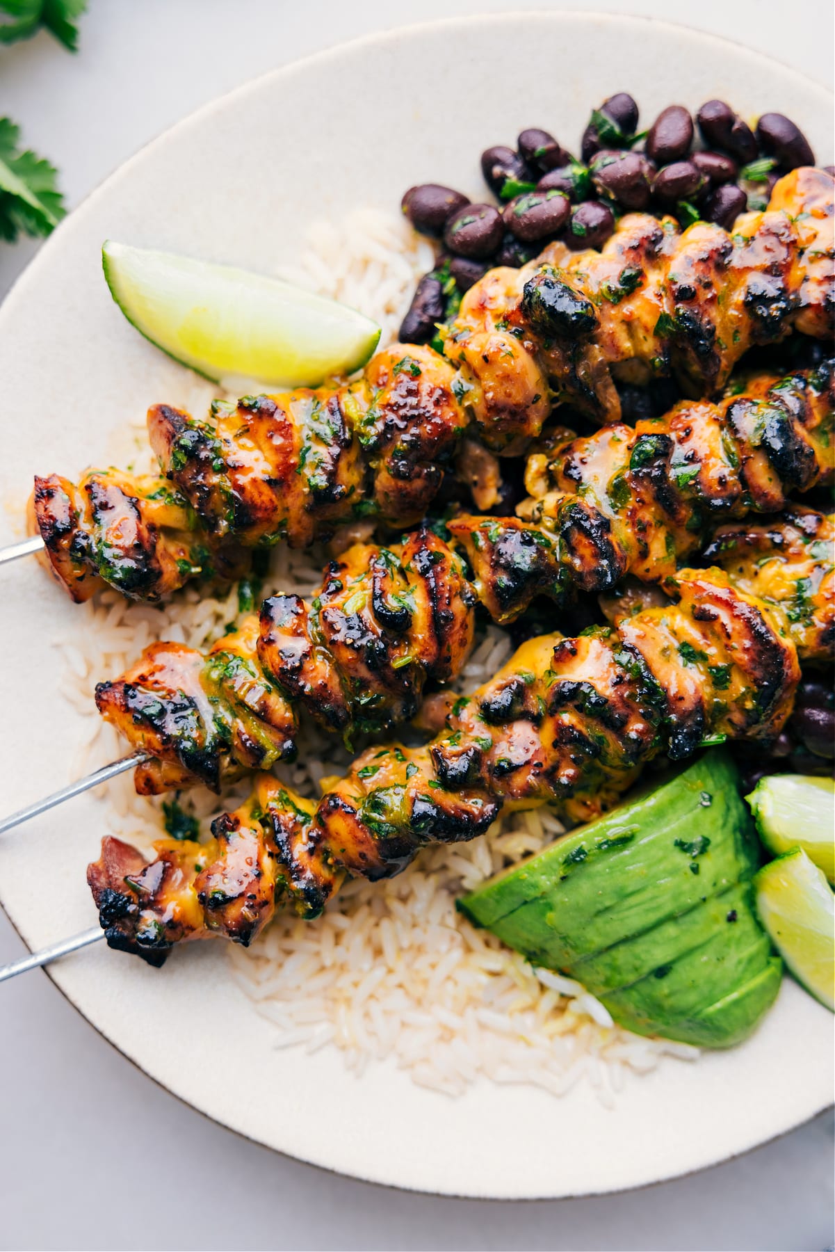 Citrus chicken, marinated and roasted to perfection, served on a bed of rice and ready to be enjoyed.