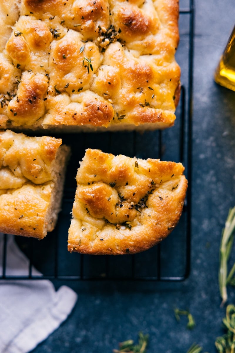 Overhead image of the Focaccia and a slice being cut out of it