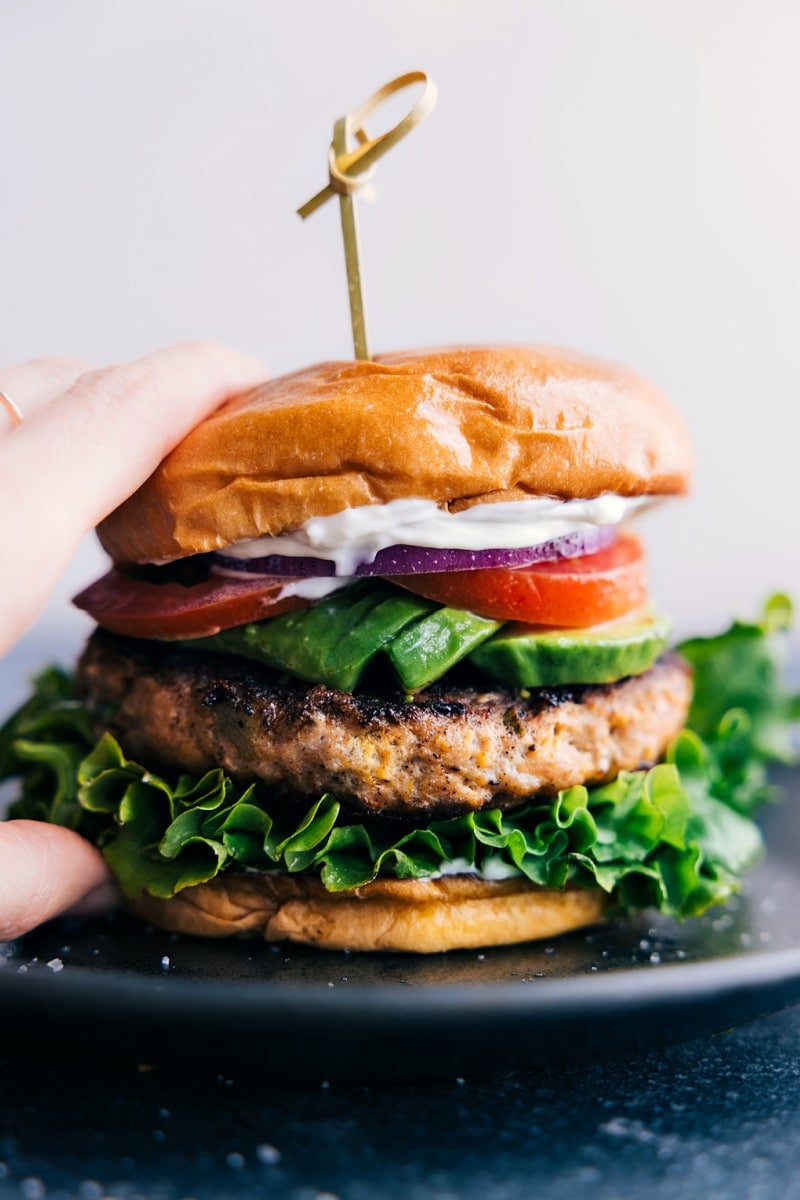 Closeup view of a Green Chile Turkey Burger with all the trimmings