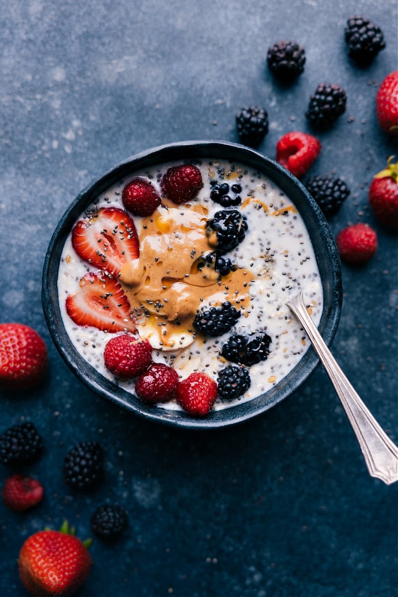 Overhead view of Overnight Oats with Chia Seeds, topped with nut butter and fruit