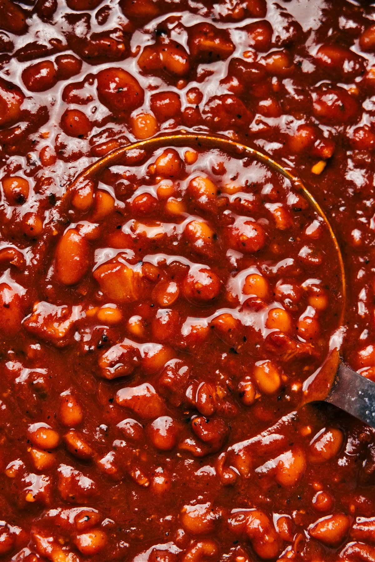 Baked beans in a pot, hot and ready to be served as the ultimate side dish.