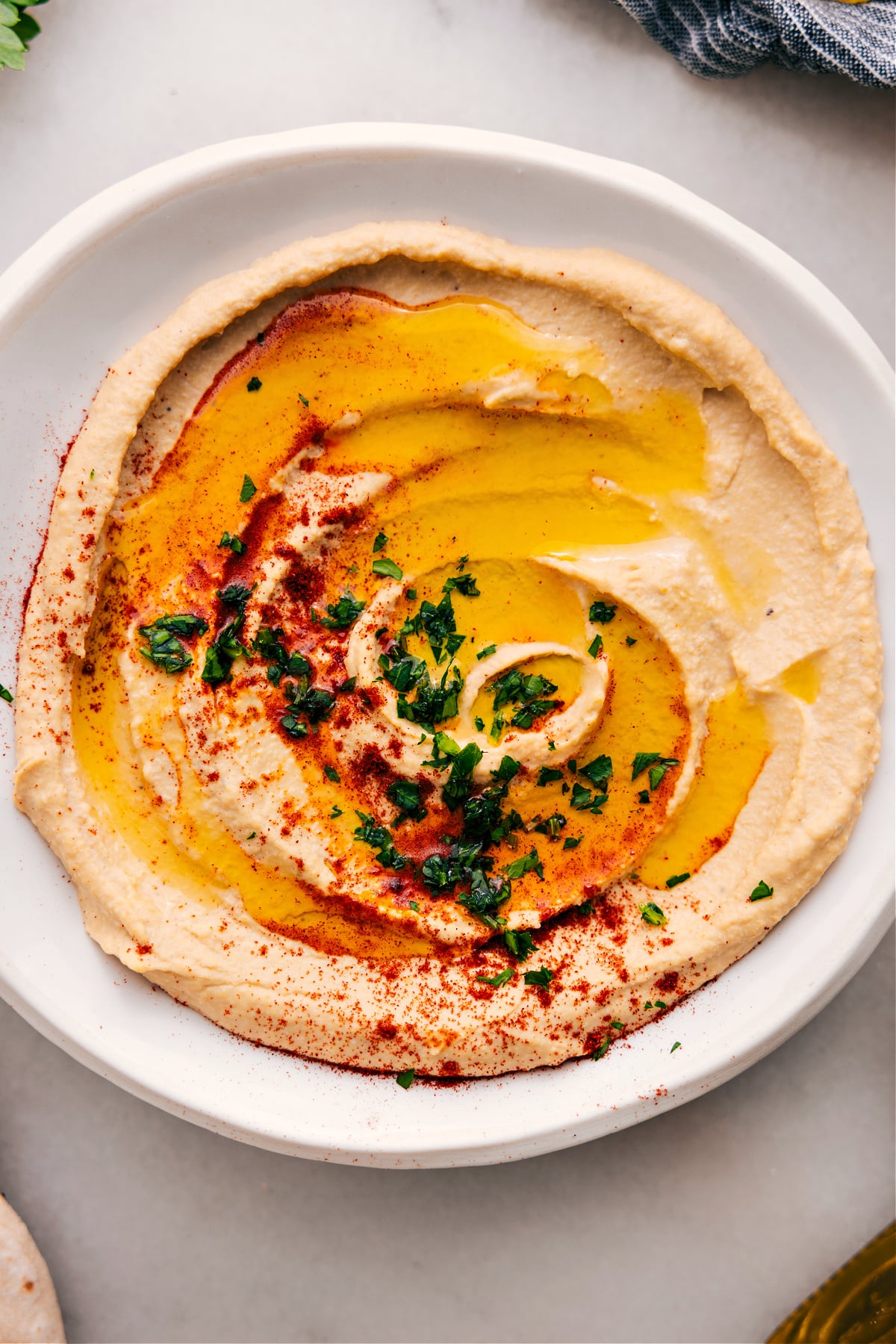 Hummus in a bowl, ready to serve and dip into.