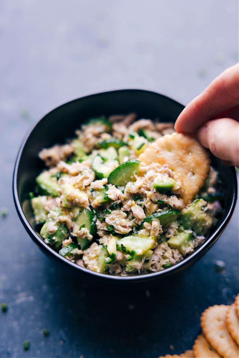 Image of a cracker scooping out the tuna salad no mayo