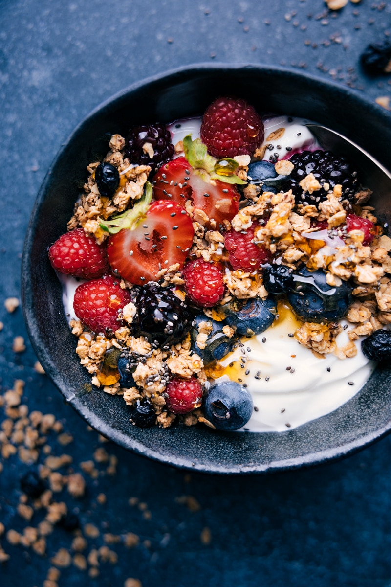 Close-up view of a bowl of granola and yogurt.