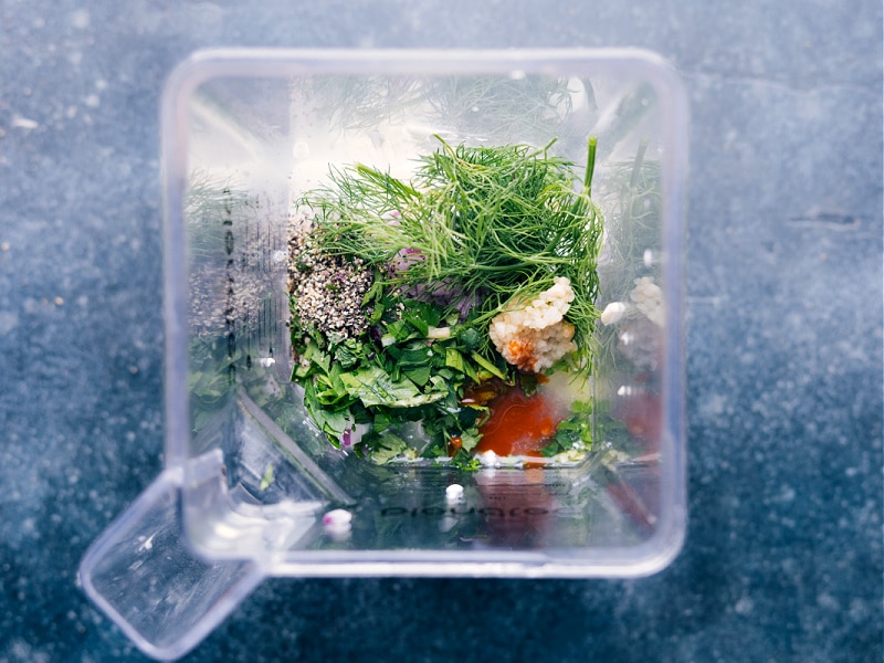 Overhead view of dressing ingredients in the blender, awaiting processing