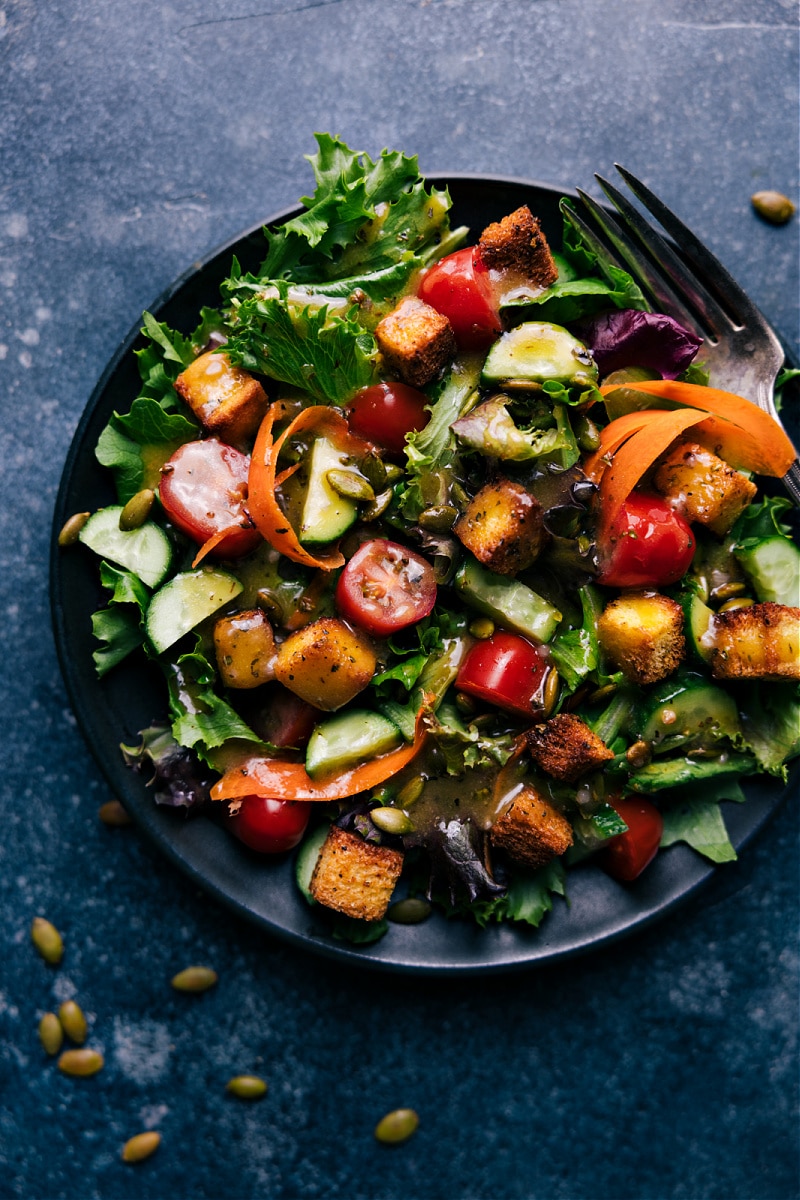 Overhead image of a salad on a plate topped with Homemade Croutons