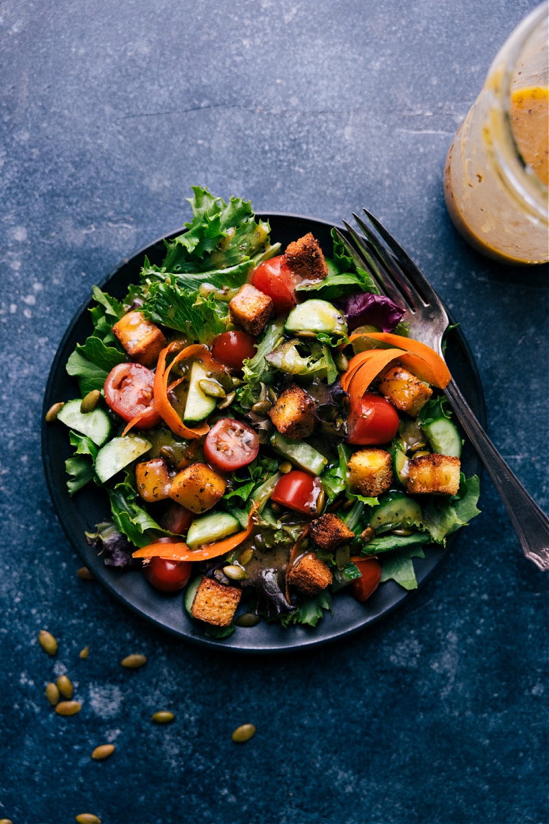 Overhead view of a salad with Vinaigrette added