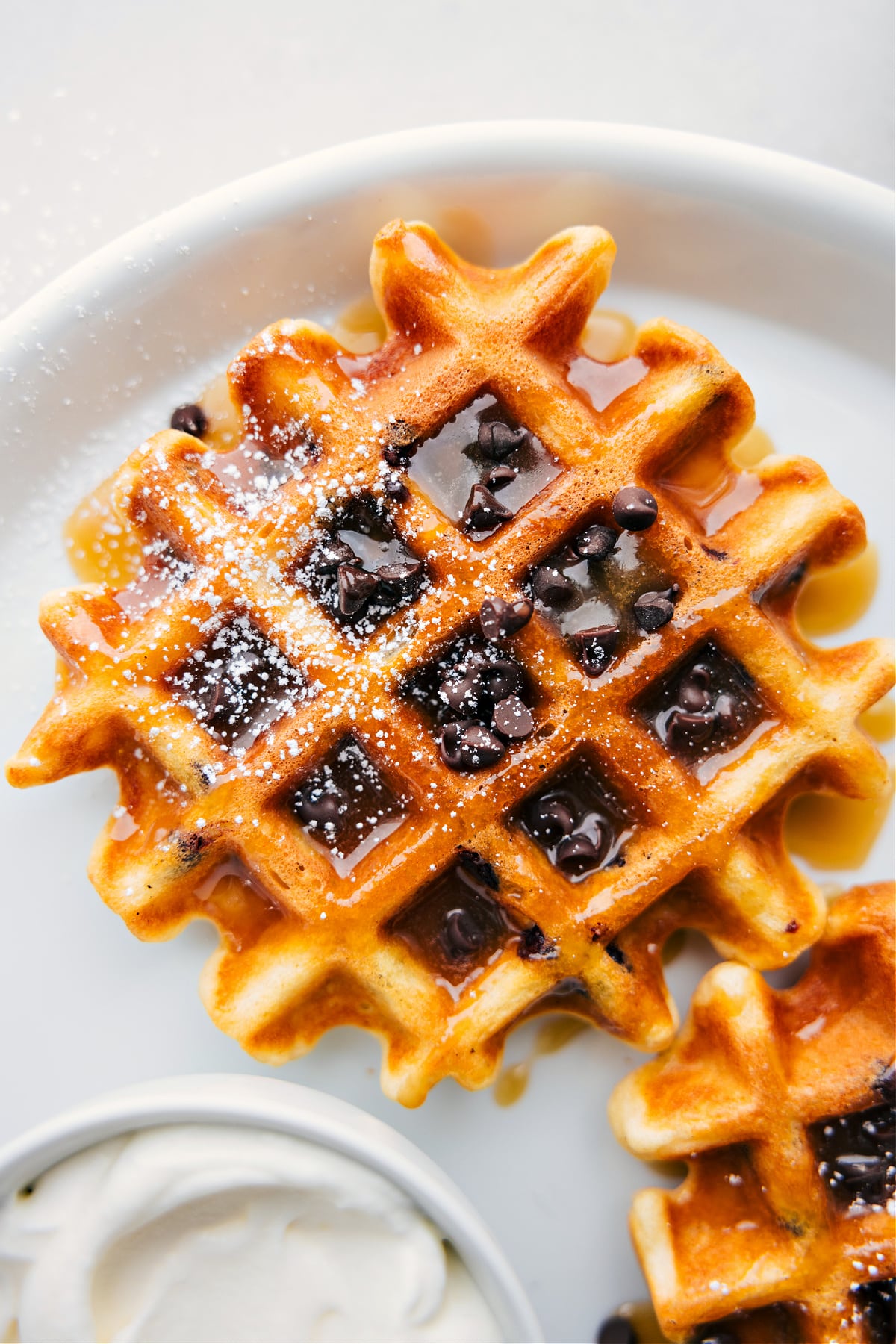 The Chocolate Chip Waffles fresh our of the waffle maker with syrup.