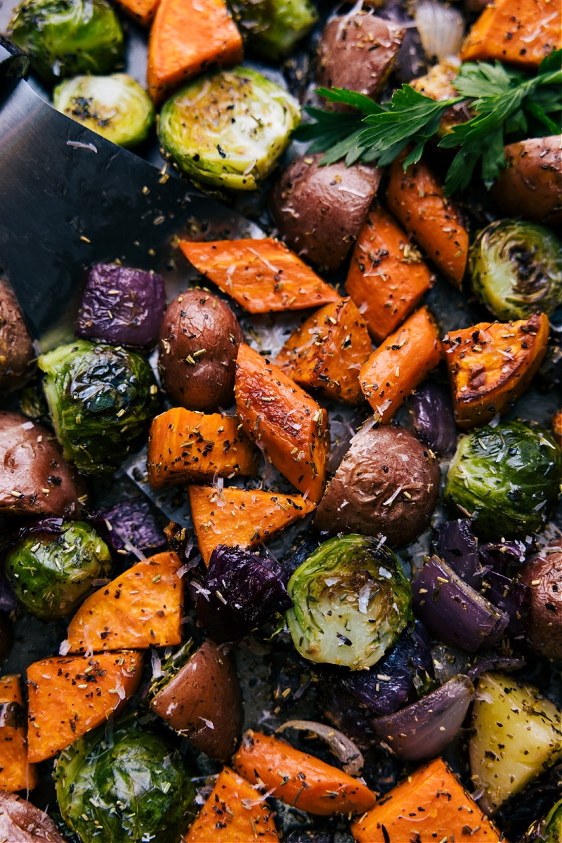 Up-close overhead image of Roasted Vegetables on a tray, ready to be enjoyed