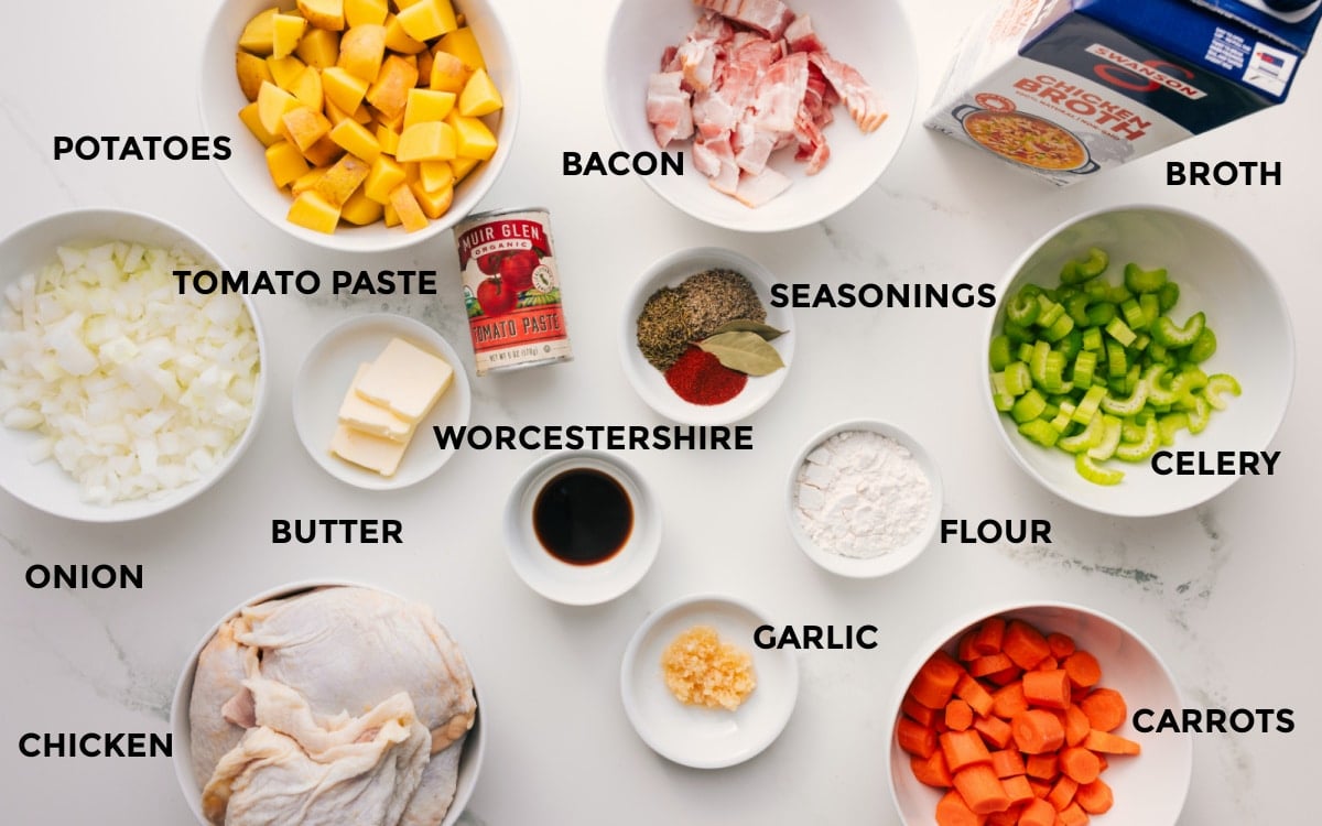 All the ingredients for this dish prepped and ready to assemble, including potatoes, onions, chicken, tomato paste, butter, bacon, seasonings, Worcestershire sauce, garlic, flour, carrots, celery, and broth